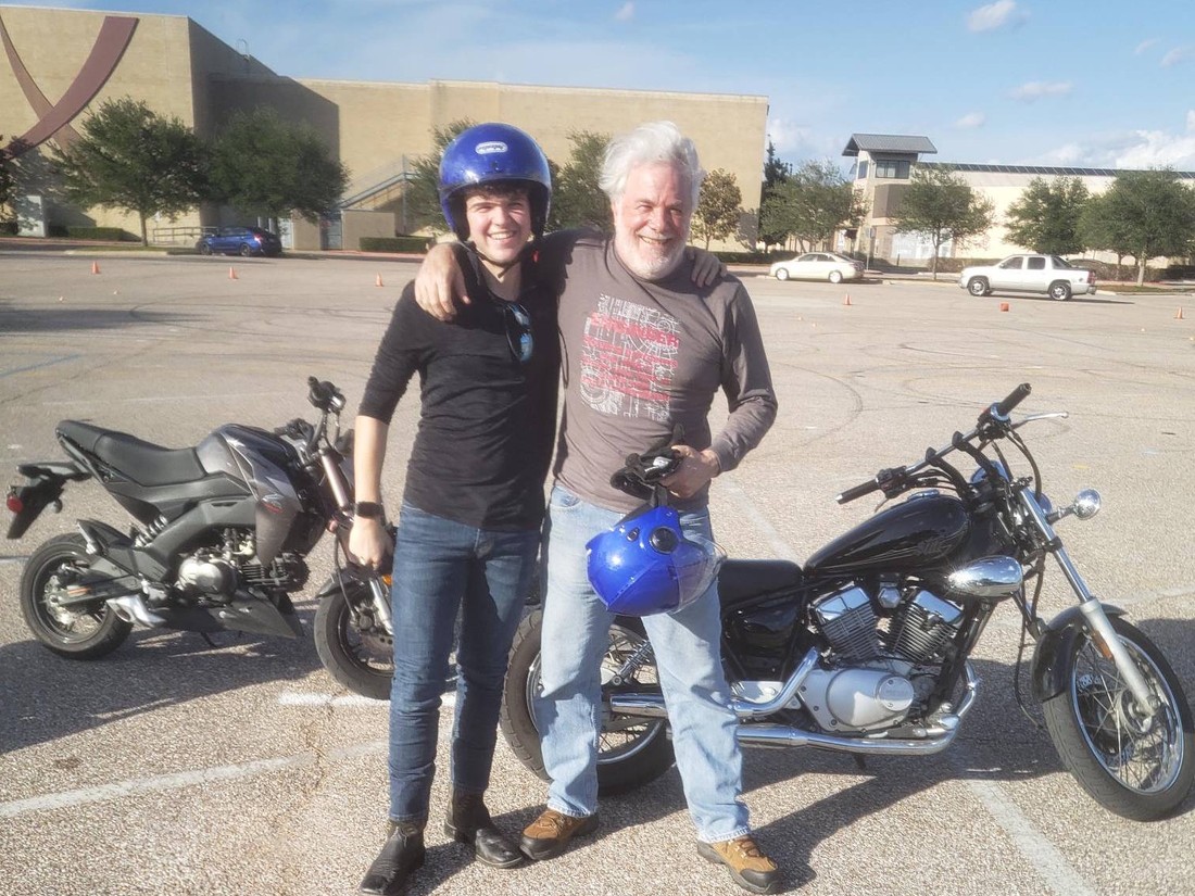 Smiling Awesome Riding motorcycle course students beside their bikes