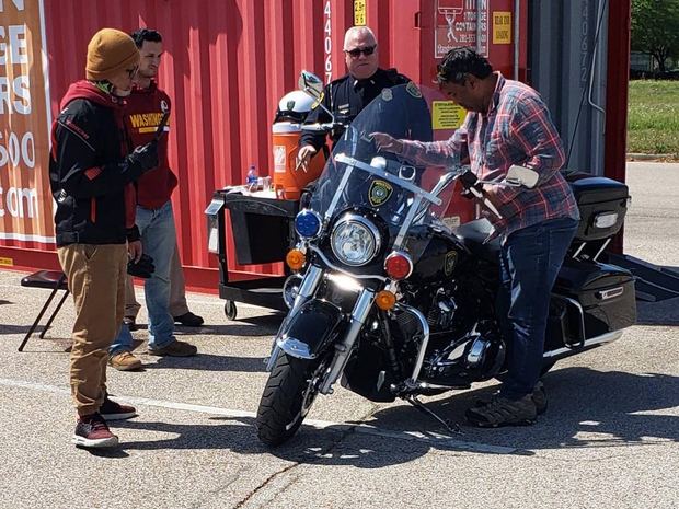 A Houston police motor officer visiting the range with students